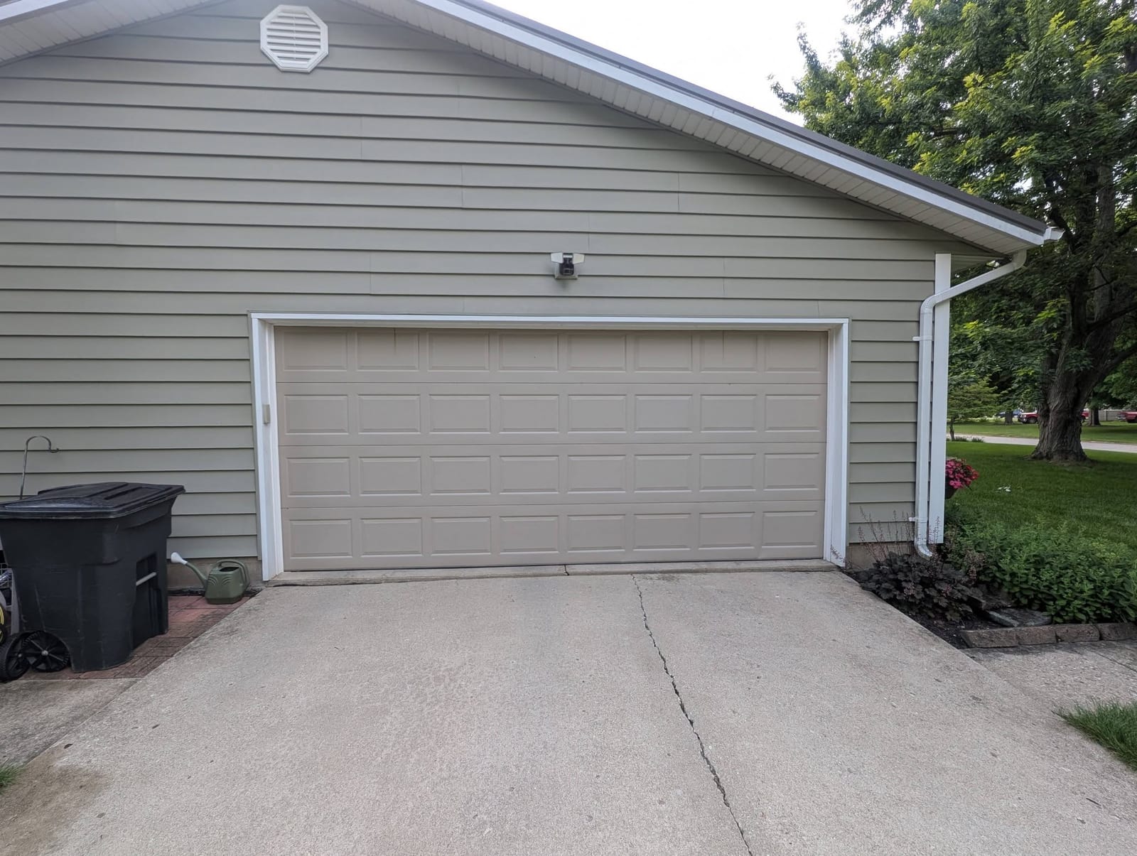 White door on a light-sided garage before replacement