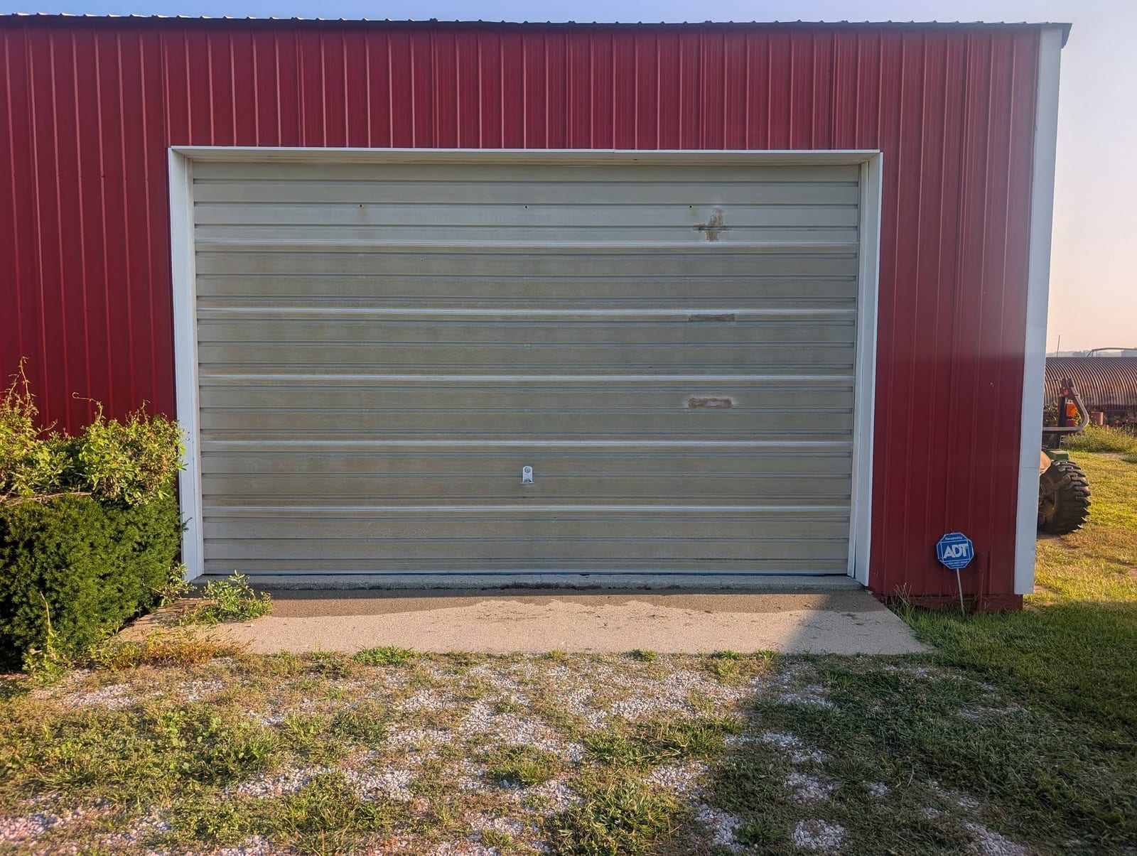 Old metal door on a red barn
